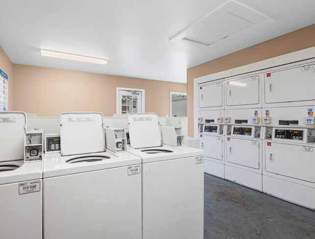 On-site laundry room with washers and dryers at Oak Hollow Apartments